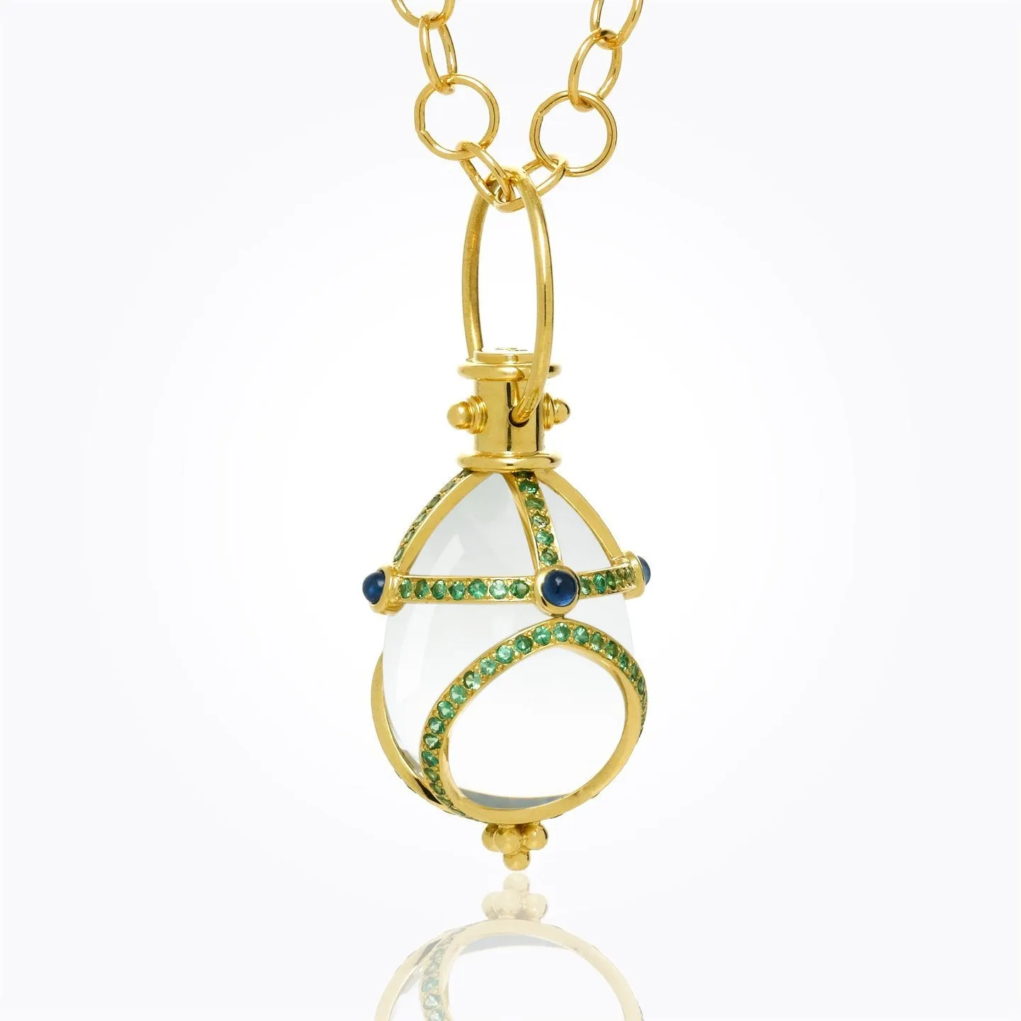 18K Stupa Amulet with oval rock crystal, blue sapphire and tsavorite